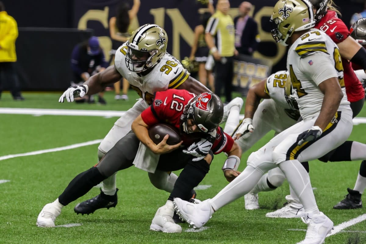 Saints defensive lineman Tanoh Kpassagnon (90) sacks Tampa Bay QB Tom Brady (12). Credit: USA TODAY 